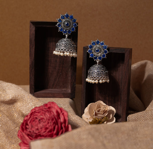 Blue Stone Studded German Silver Jhumki Earrings With Hanging Pearls