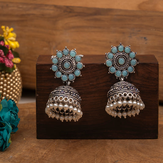 Mint Stone Studded German Silver Jhumki Earrings With Hanging Pearls