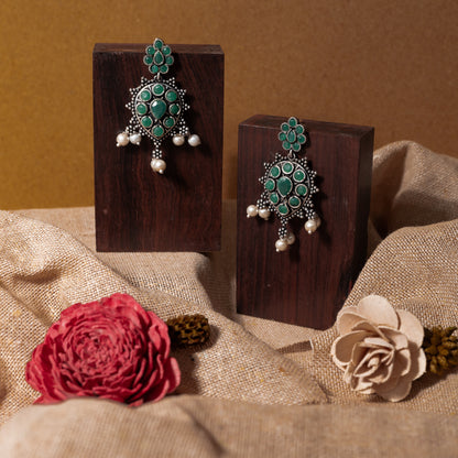 Green Stone Studded German Silver Stud Earrings With Hanging Pearls