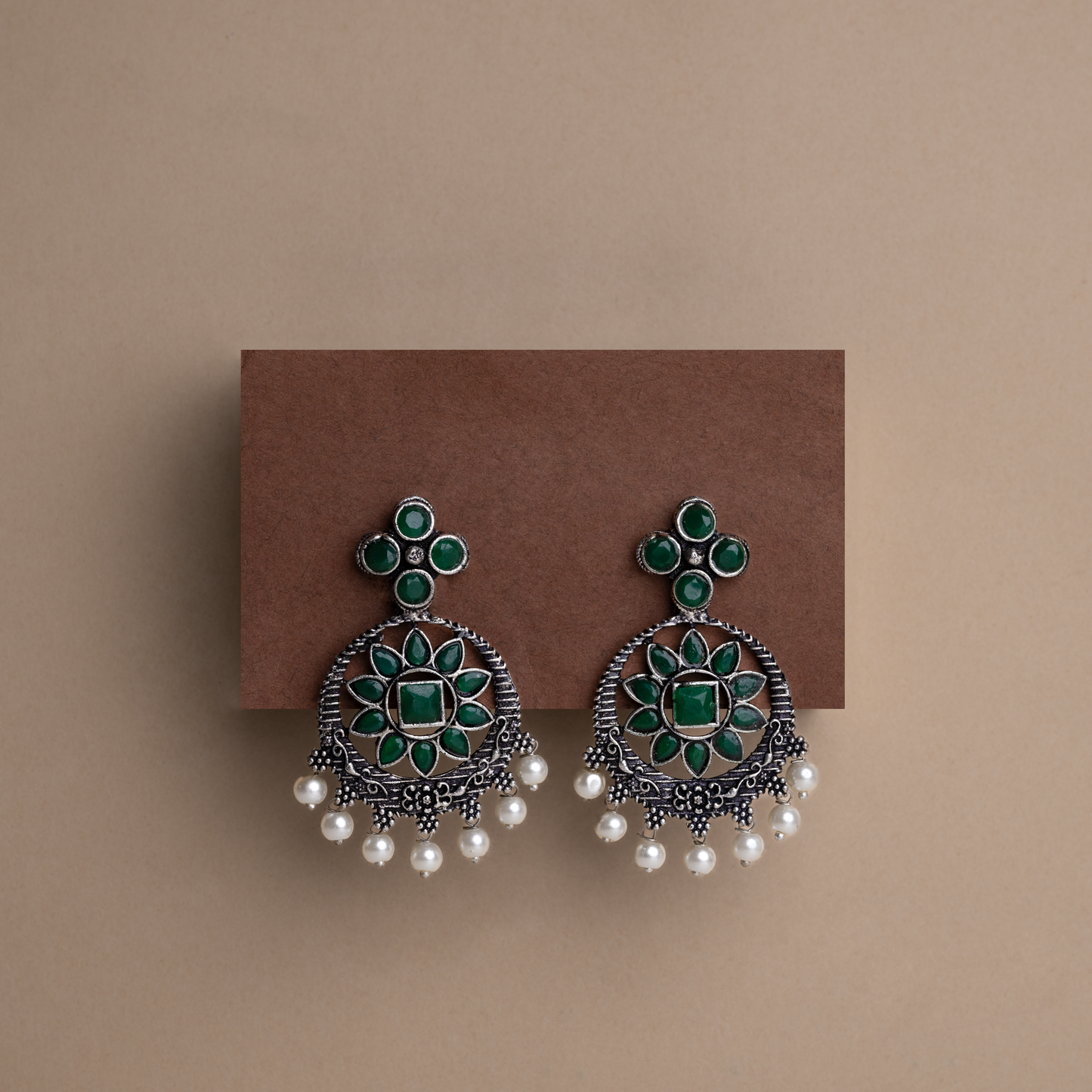 Green Stone Studded German Silver Stud Earrings With Hanging Pearls