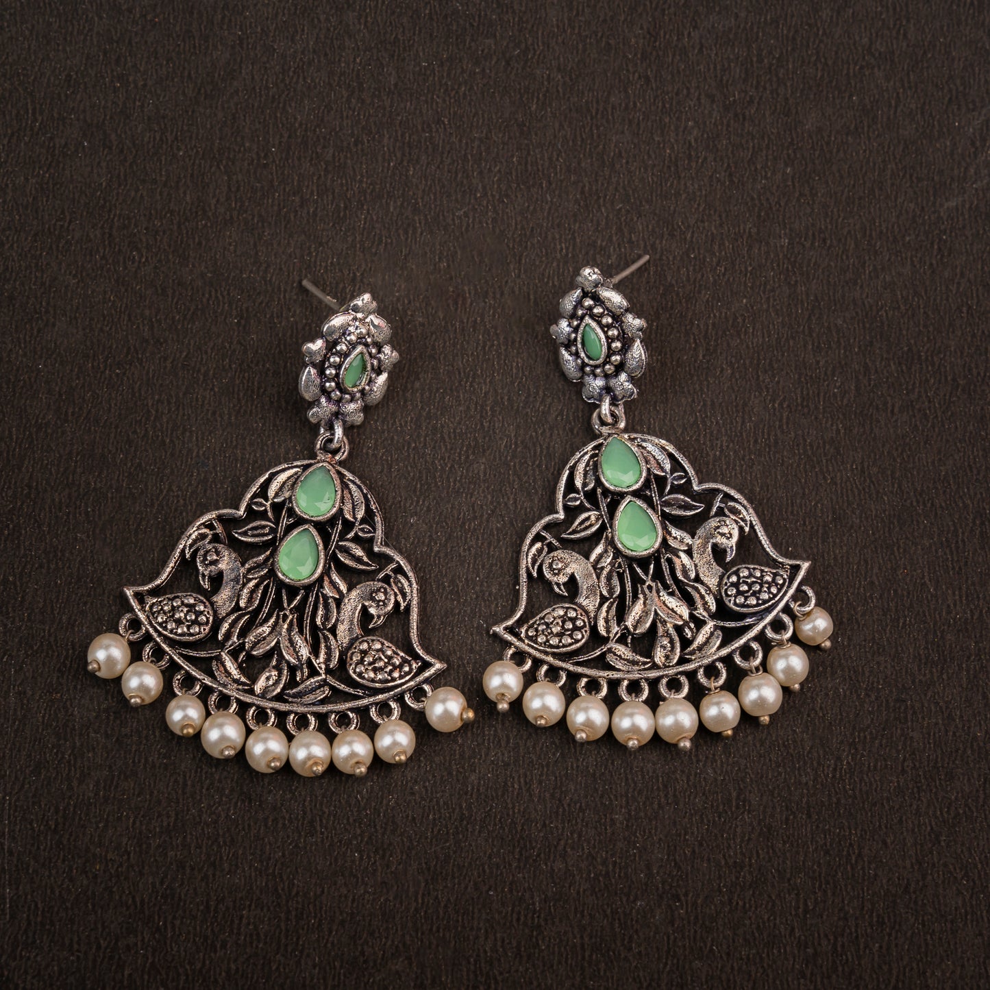 Pista Stone Studded Oxidised Earrings With Hanging Jhumka