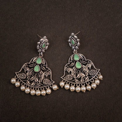 Pista Stone Studded Oxidised Earrings With Hanging Jhumka