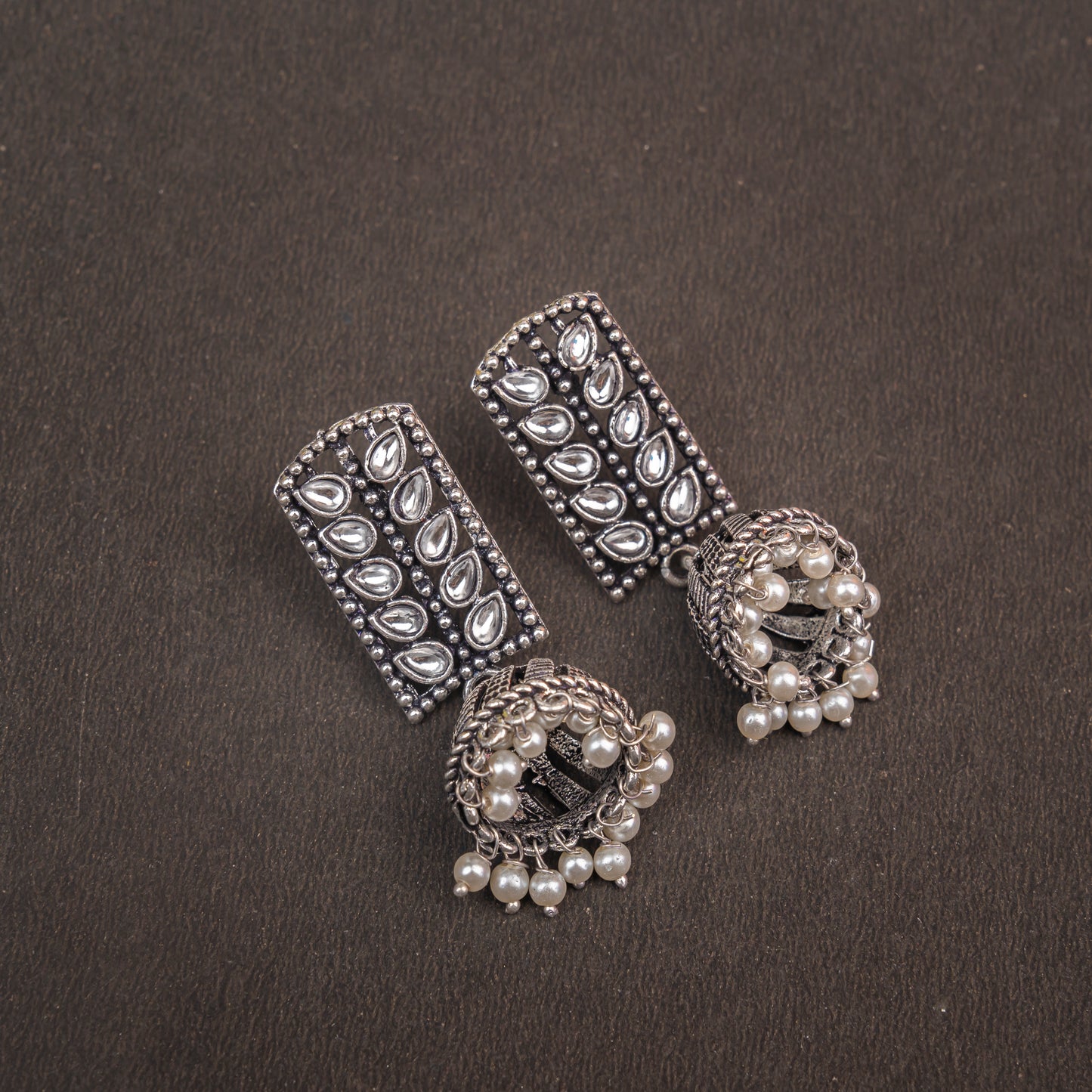 White Stone Studded German Silver Statement Earrings With Brass Jhumki