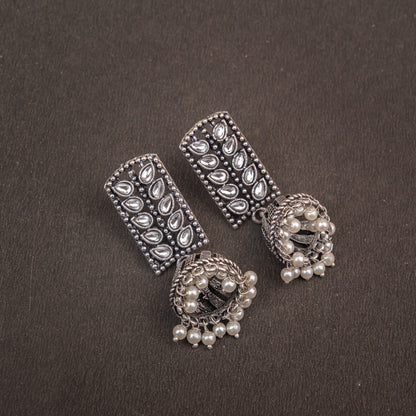 White Stone Studded German Silver Statement Earrings With Brass Jhumki