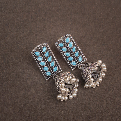 Sky Blue Stone Studded German Silver Statement Earrings With Brass Jhumki