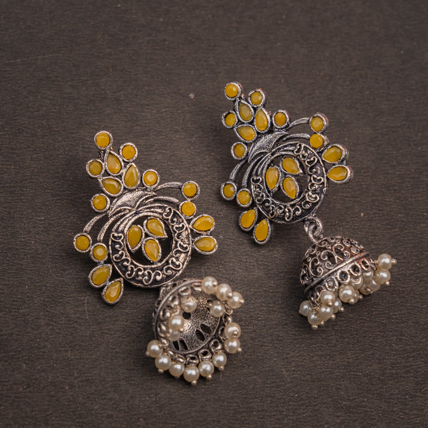 Yellow Stone Studded Oxidised Earrings With Hanging Jhumka