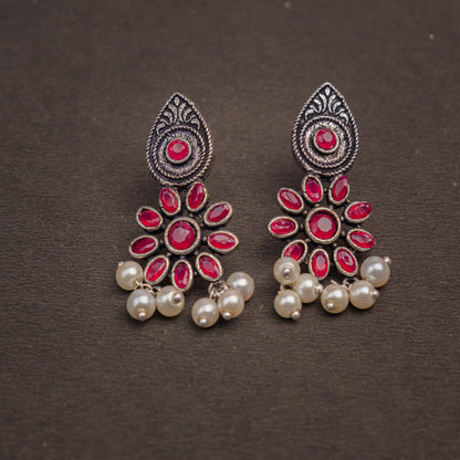 Red Stone Studded Oxidised Earrings With Hanging Pearls