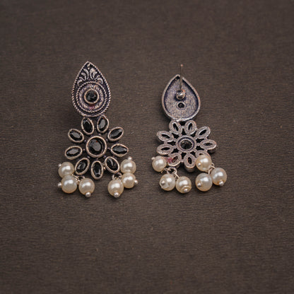 Black Stone Studded Oxidised Earrings With Hanging Pearls
