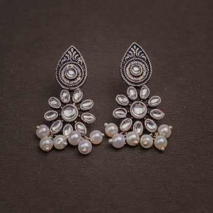 White Stone Studded Oxidised Earrings With Hanging Pearls