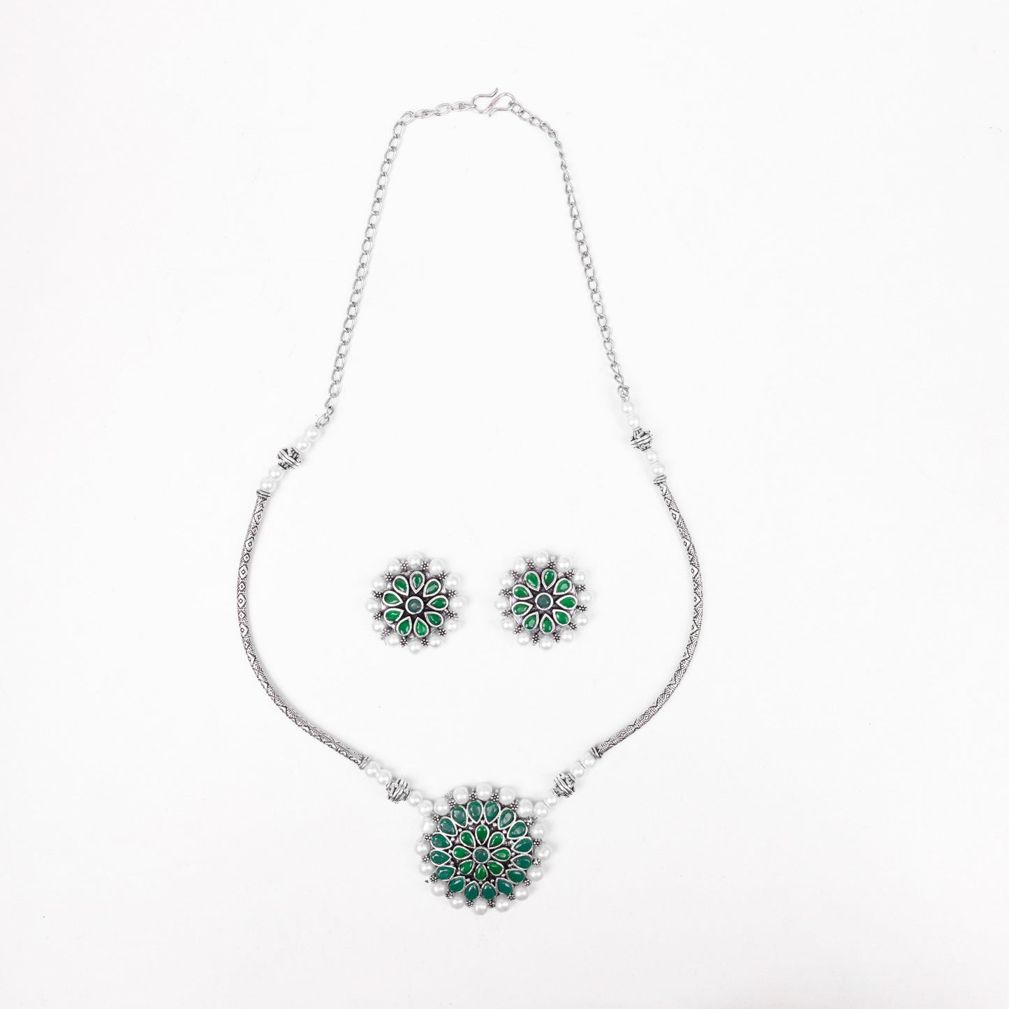 Stylish Brass Piped Neckpiece With Earrings Embellished With Green Stone And Pearls