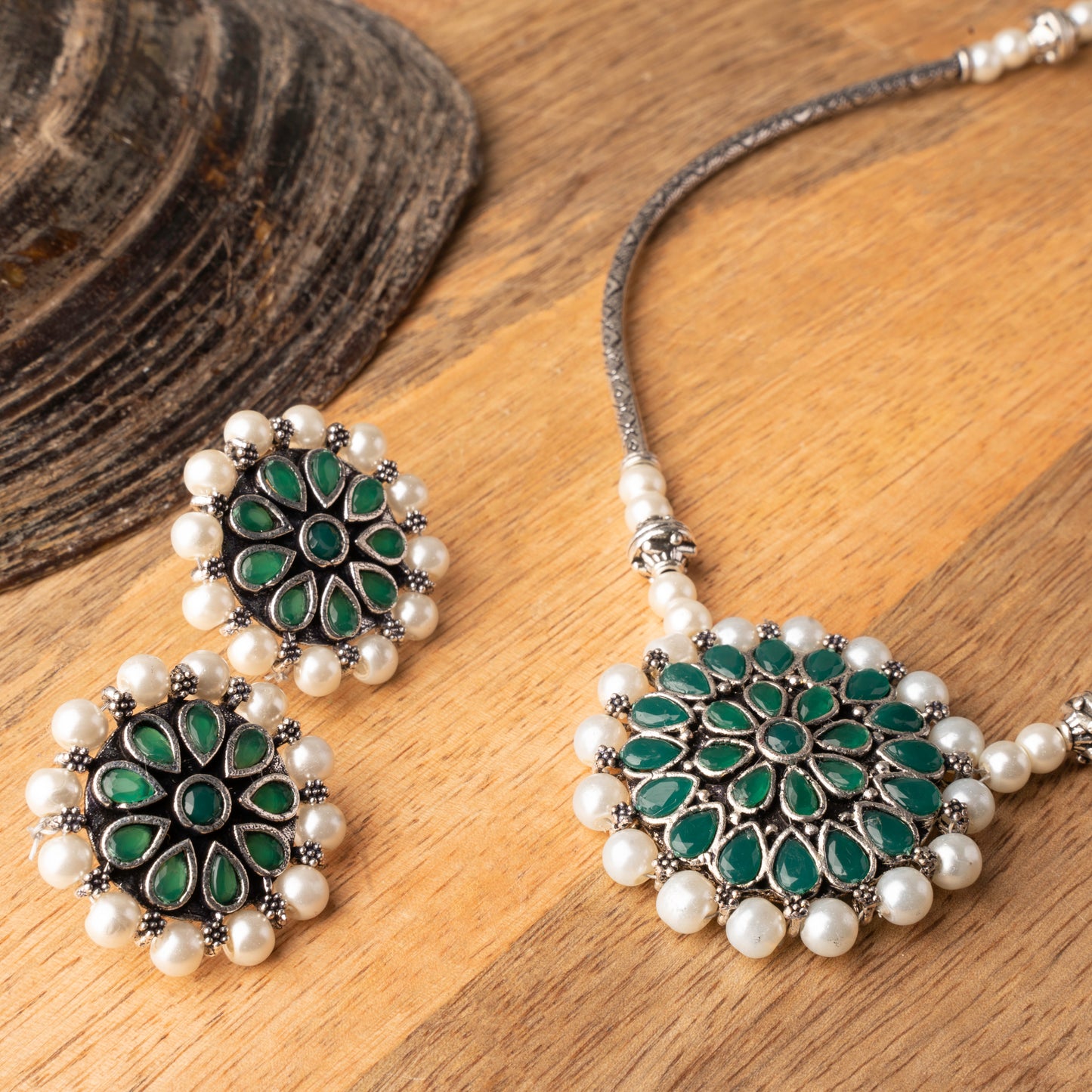 Stylish Brass Piped Neckpiece With Earrings Embellished With Green Stone And Pearls