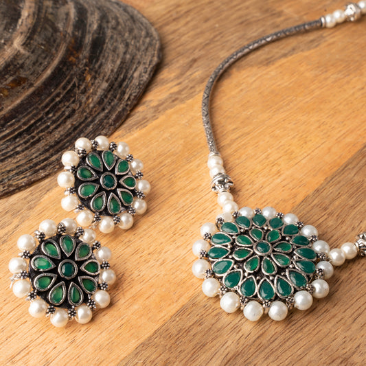 Stylish Brass Piped Neckpiece With Earrings Embellished With Green Stone And Pearls
