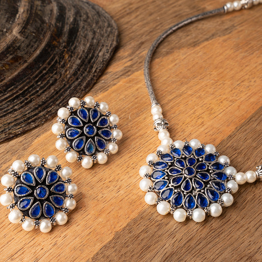 Stylish Brass Piped Neckpiece With Earrings Embellished With Blue Stone And Pearls
