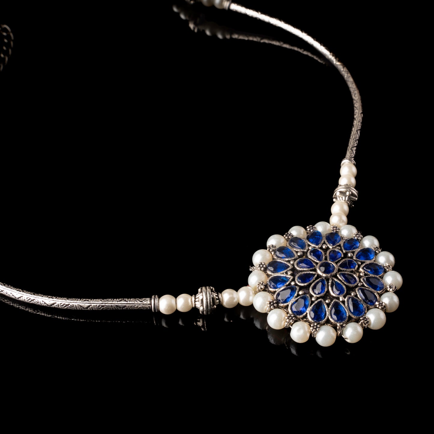 Stylish Brass Piped Neckpiece With Earrings Embellished With Blue Stone And Pearls