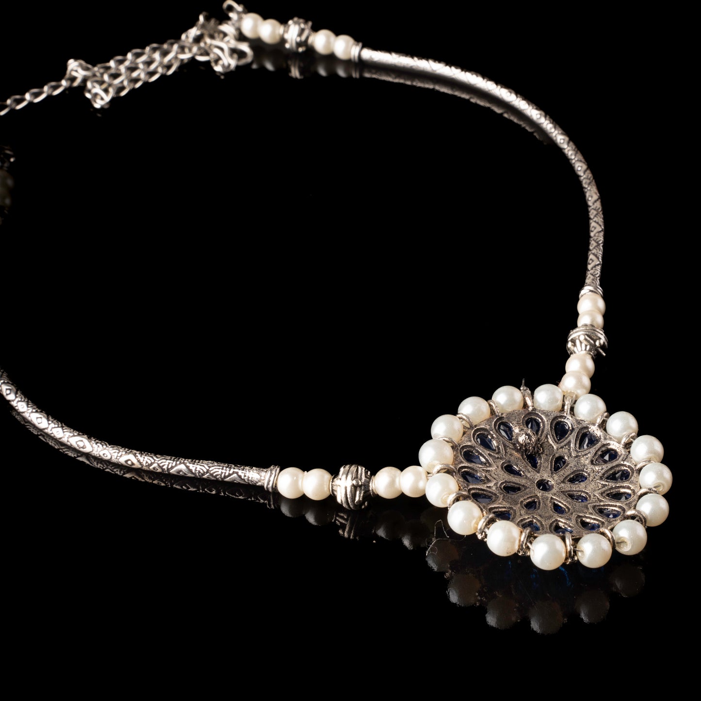 Stylish Brass Piped Neckpiece With Earrings Embellished With Blue Stone And Pearls