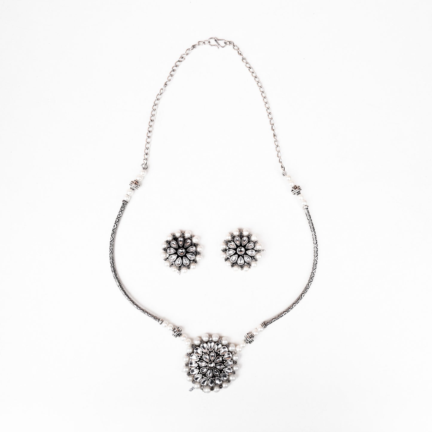 Stylish Brass Piped Neckpiece With Earrings Embellished With White Stone And Pearls