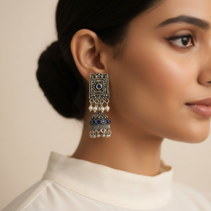 oxidized  jhumka earrings with pearl and Blue stone detailing.