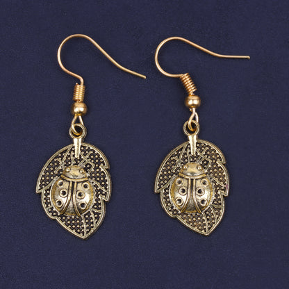 Leaf Beetle Shaped Golden Polished Oxidised Danglers