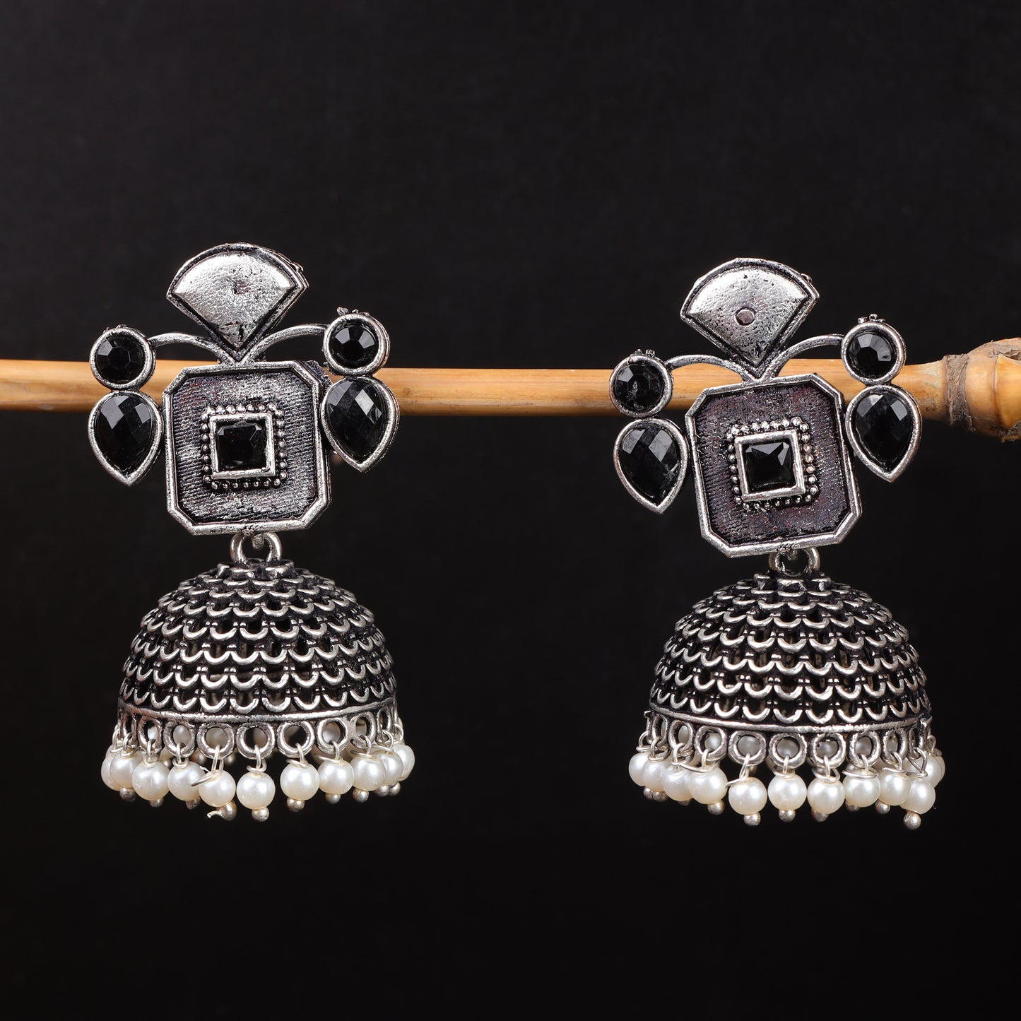 Black Stone Studded Statement Earrings With Hanging Jhumka Embellished With Baby Pearls