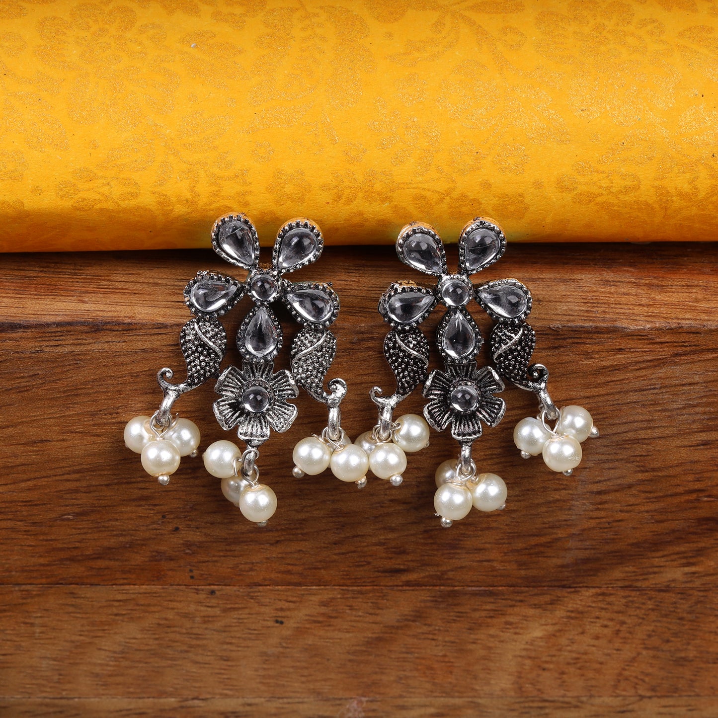 White Stone Studded Oxidised Earrings With Hanging Pearl