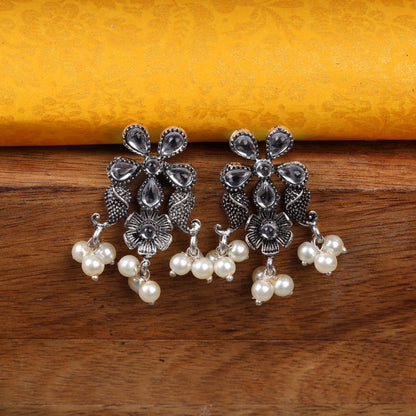 White Stone Studded Oxidised Earrings With Hanging Pearl