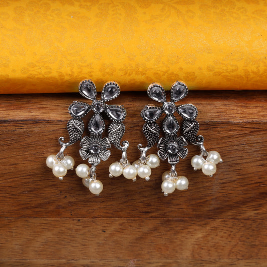 White Stone Studded Oxidised Earrings With Hanging Pearl