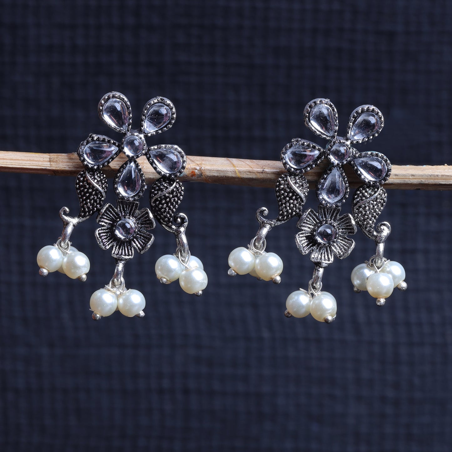White Stone Studded Oxidised Earrings With Hanging Pearl