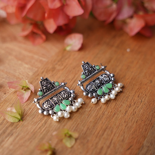 Pista Stone Studded Oxidised Earrings With Hanging Pearl