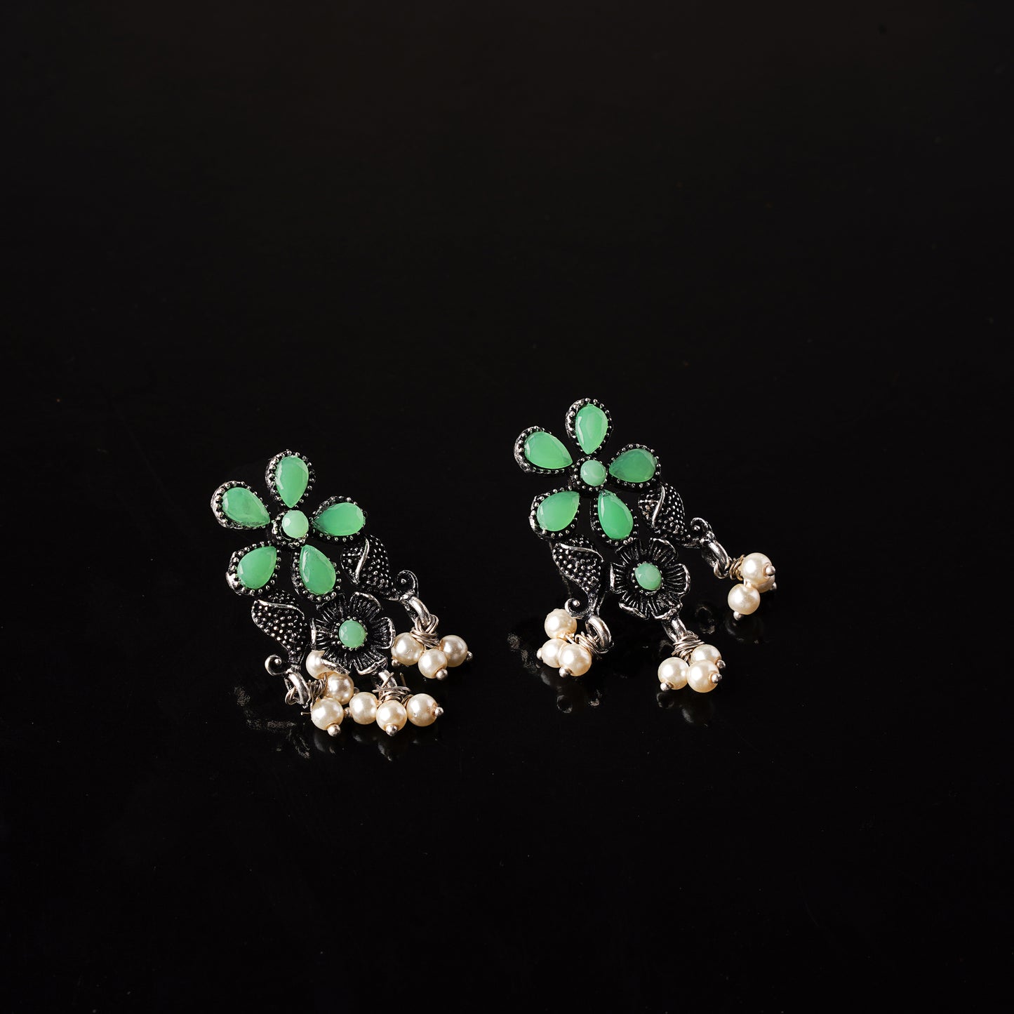 Pista Stone Studded Oxidised Earrings With Hanging Pearl