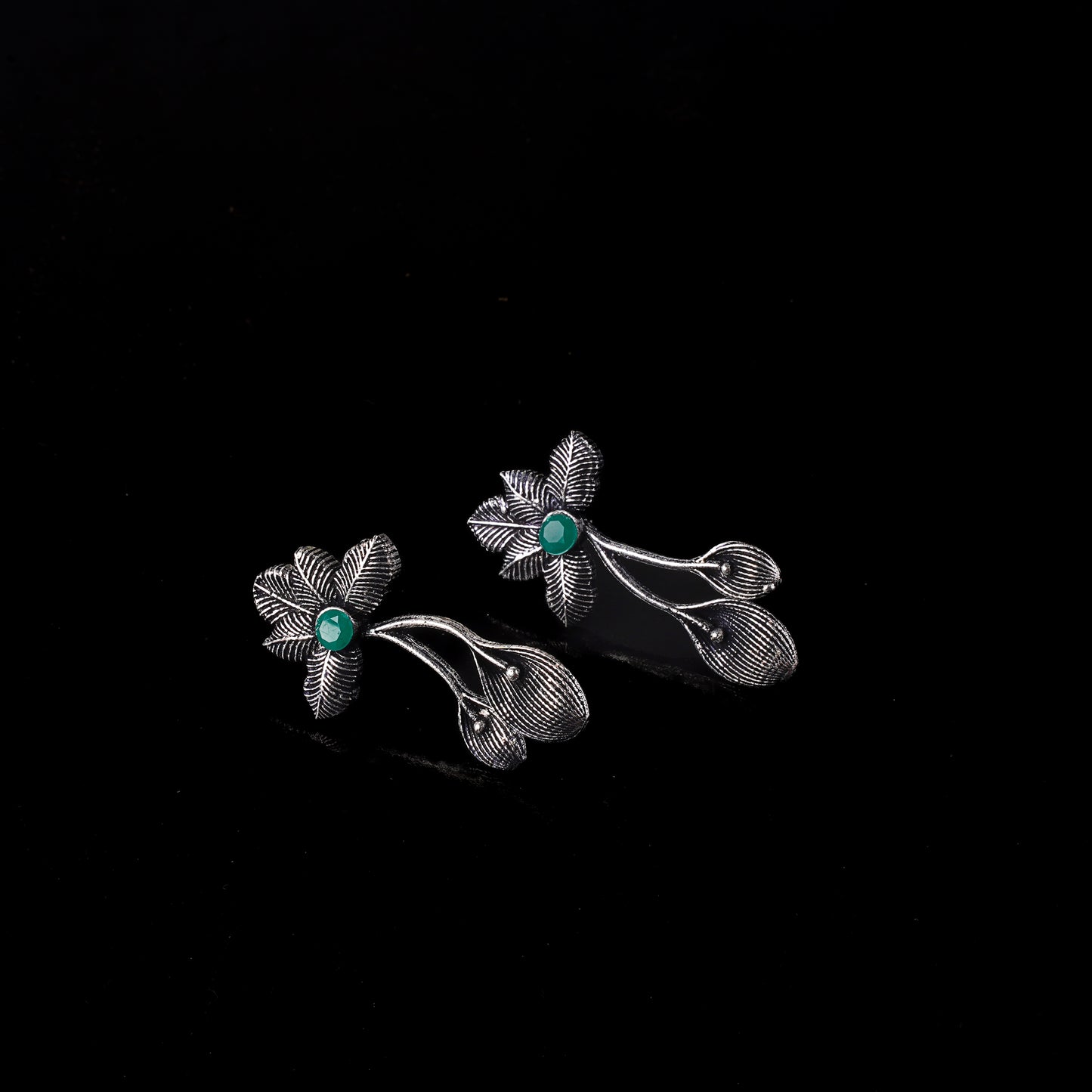 Green Stone Studded Flower Shaped Intricate Oxidised Earrings