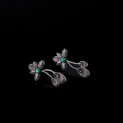 Green Stone Studded Flower Shaped Intricate Oxidised Earrings