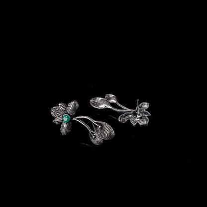 Green Stone Studded Flower Shaped Intricate Oxidised Earrings