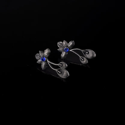 Blue Stone Studded Flower Shaped Intricate Oxidised Earrings
