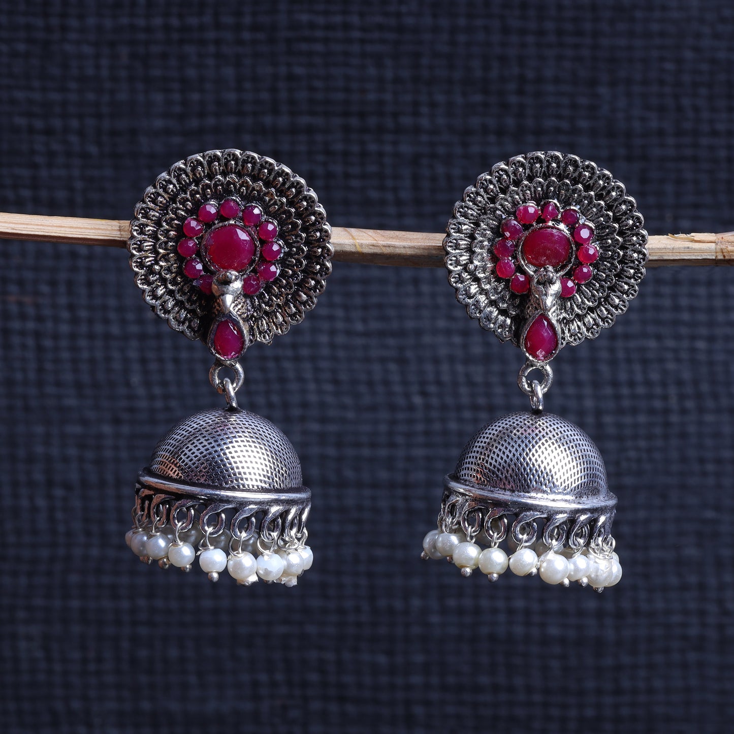 Red Stone Embellished German Silver Earrings With Hanging Pearls