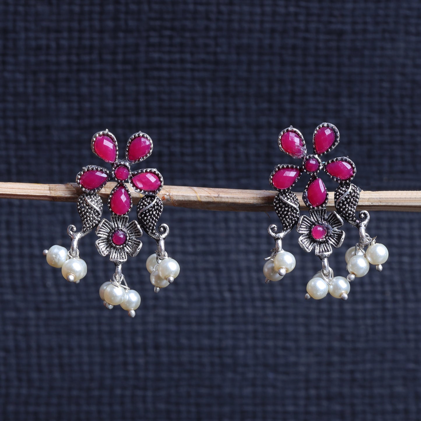 Red Stone Studded Oxidised Earrings With Hanging Pearls