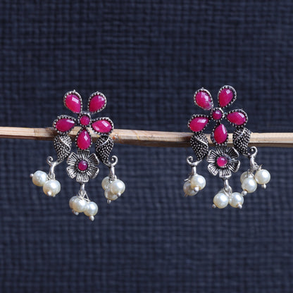 Red Stone Studded Oxidised Earrings With Hanging Pearls