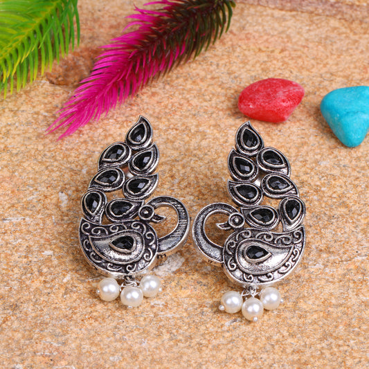 Black Stone Studded Peacock German Silver Earrings With Hanging Pearls