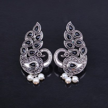 Black Stone Studded Peacock German Silver Earrings With Hanging Pearls