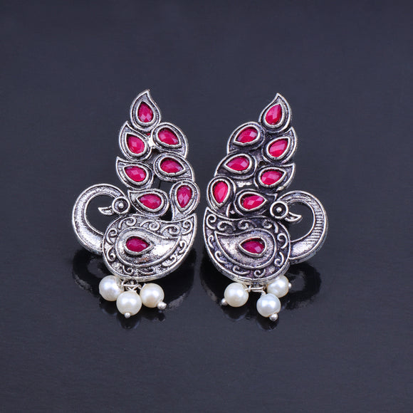 Red Stone Studded Peacock German Silver Earrings With Hanging Pearls