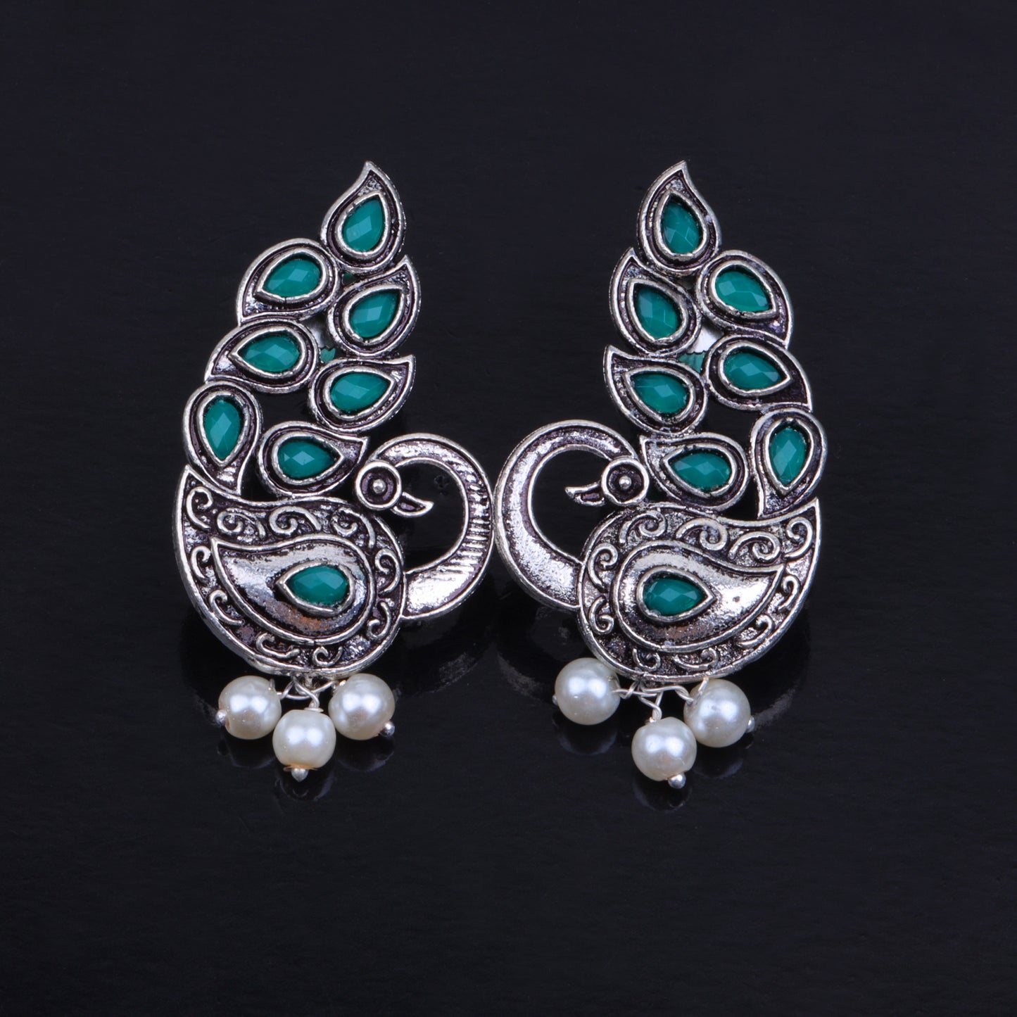 Green Stone Studded Peacock German Silver Earrings With Hanging Pearls