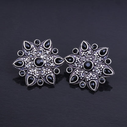 Black Stone Studded Star Shaped German Silver Stud Earrings