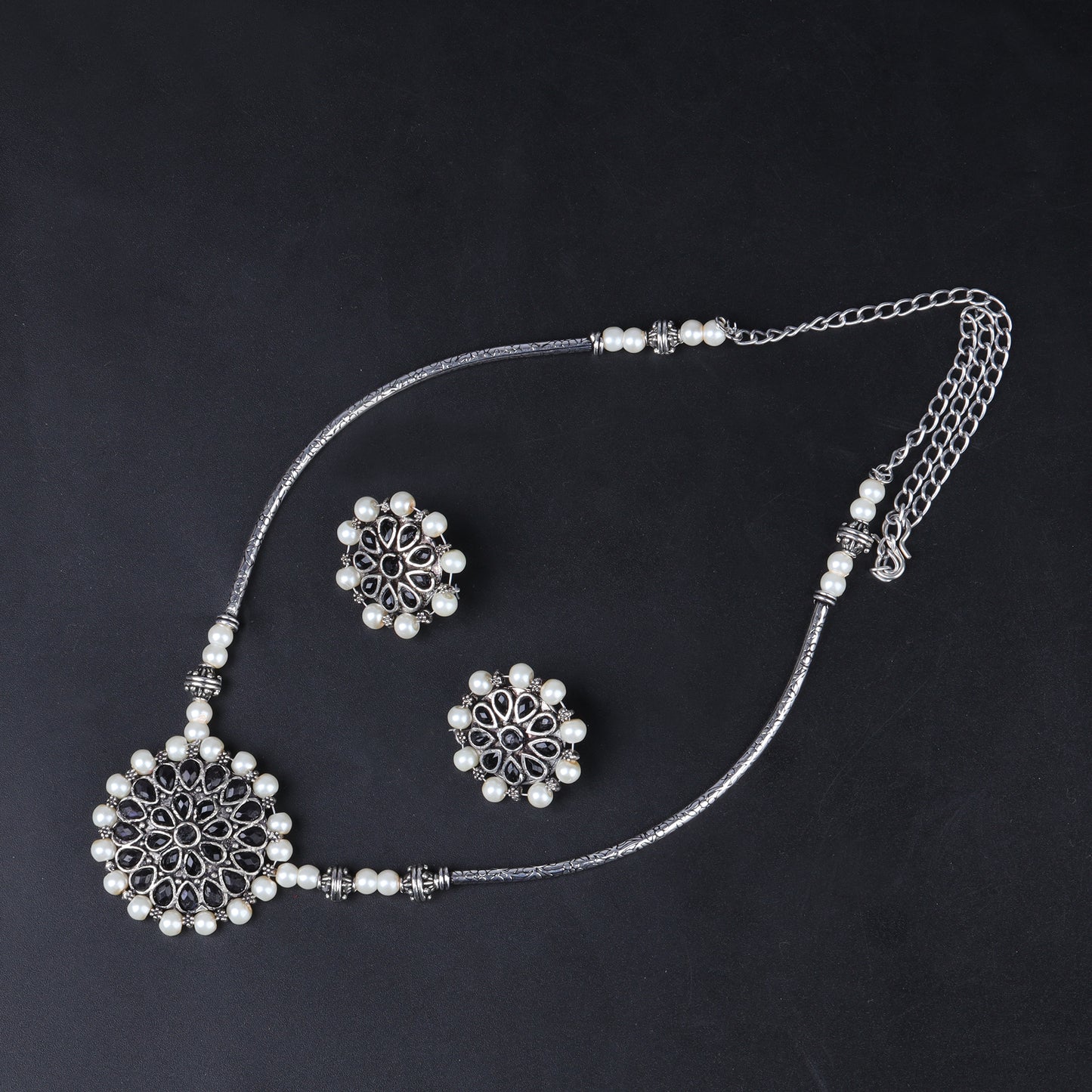 Stylish Brass Piped Neckpiece With Earrings Embellished With Black Stone And Pearls