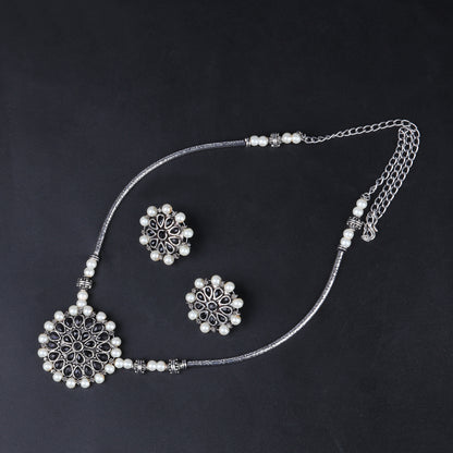 Stylish Brass Piped Neckpiece With Earrings Embellished With Black Stone And Pearls