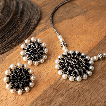 Stylish Brass Piped Neckpiece With Earrings Embellished With Black Stone And Pearls