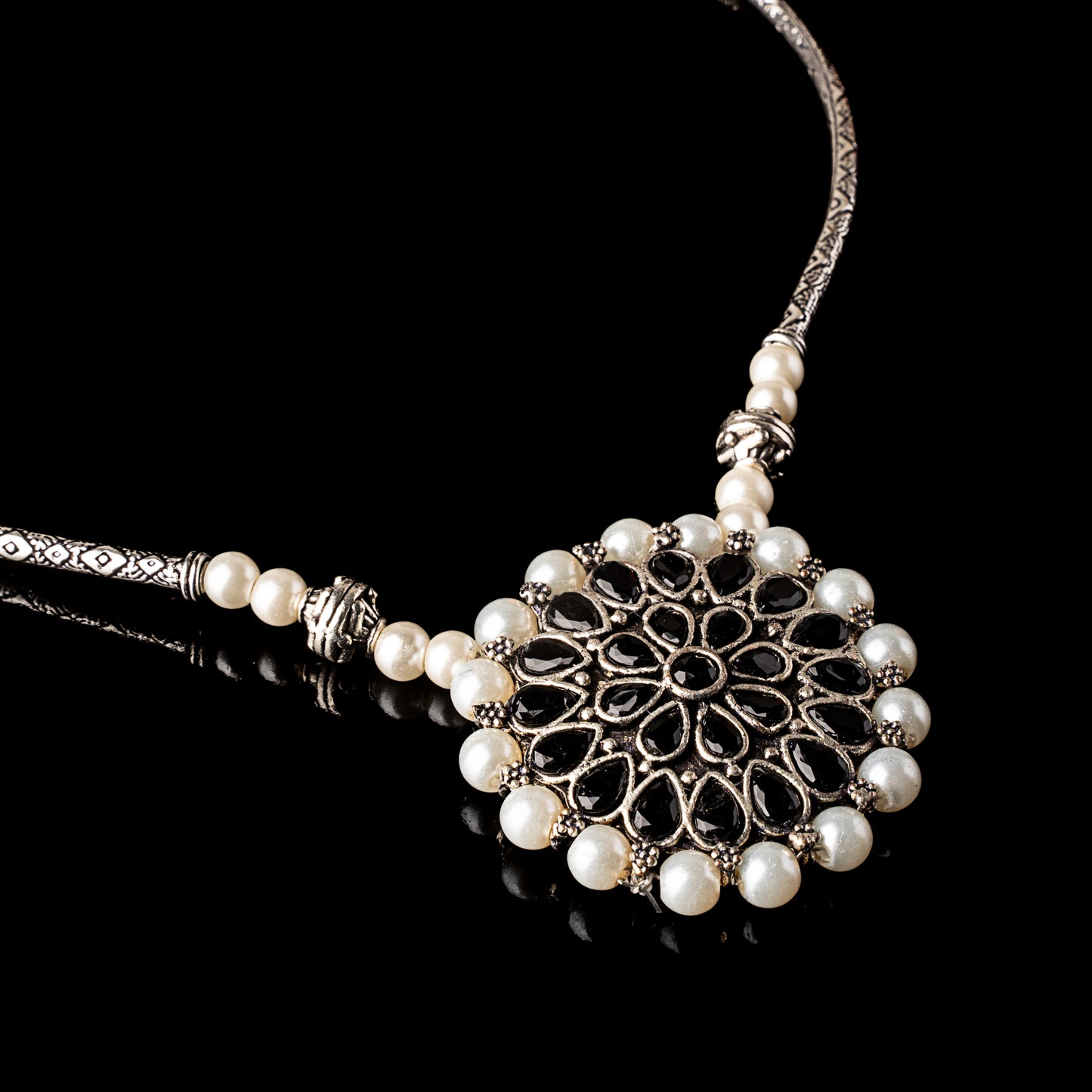 Stylish Brass Piped Neckpiece With Earrings Embellished With Black Stone And Pearls